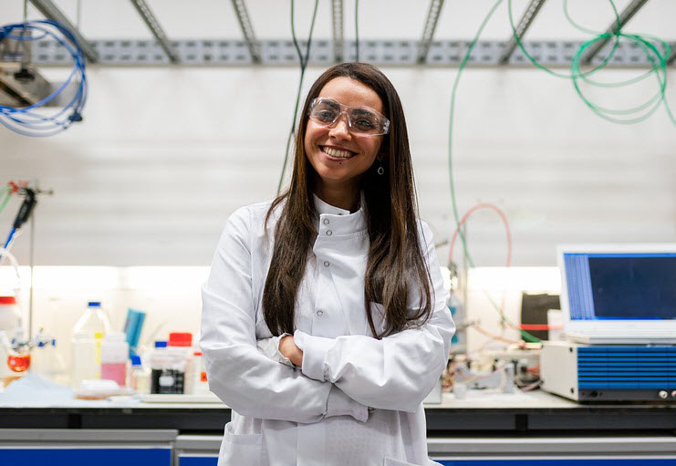 Young female researcher smiling and looking into the camera